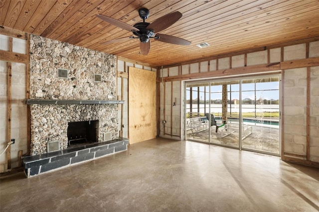 unfurnished living room featuring ceiling fan, wooden ceiling, a fireplace, and concrete floors