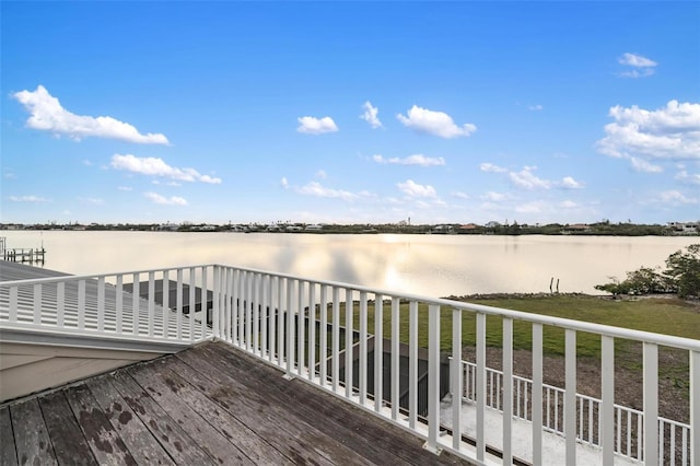 wooden deck featuring a water view