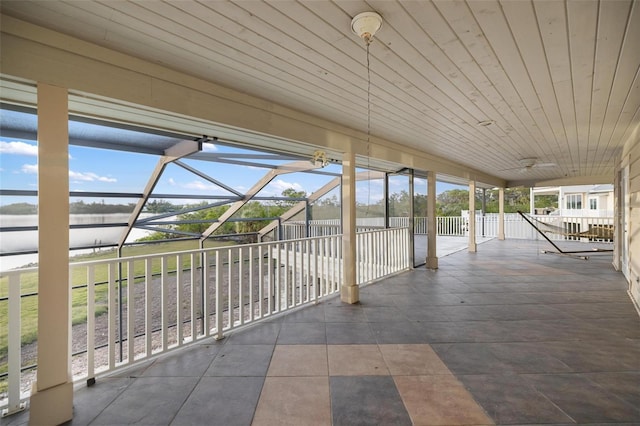 view of patio / terrace featuring glass enclosure