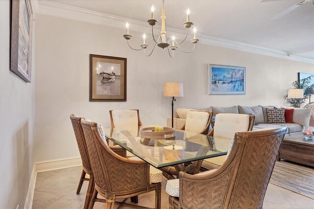 tiled dining space featuring ornamental molding and a notable chandelier
