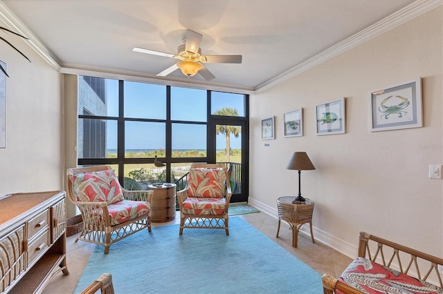 living area featuring a wall of windows, ceiling fan, light tile patterned floors, and ornamental molding