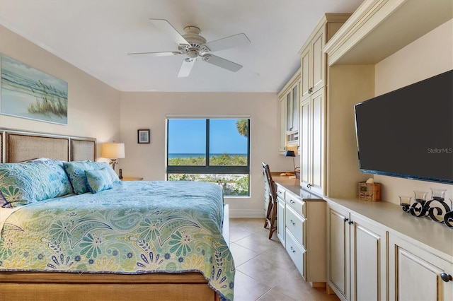 tiled bedroom featuring ceiling fan