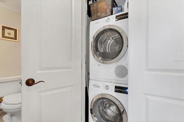 laundry area with stacked washer and dryer