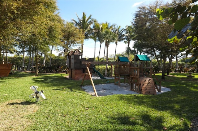 view of jungle gym featuring a lawn