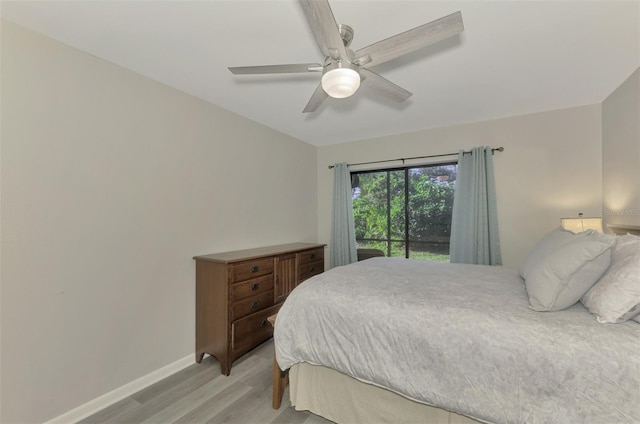 bedroom with ceiling fan and light hardwood / wood-style floors