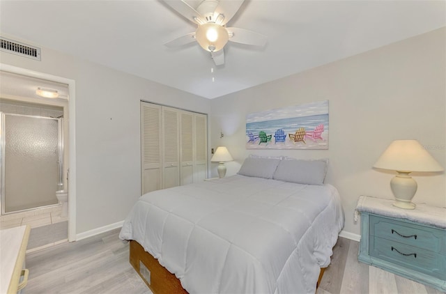 bedroom with light wood-type flooring, a closet, ensuite bathroom, and ceiling fan