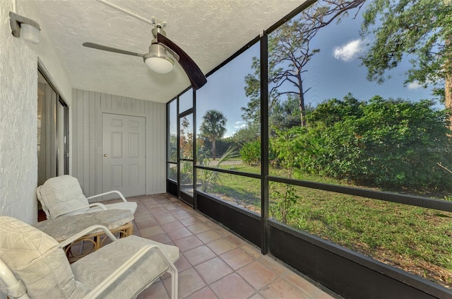 sunroom / solarium with ceiling fan