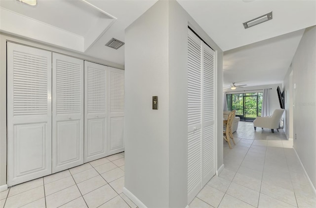 corridor with light tile patterned flooring