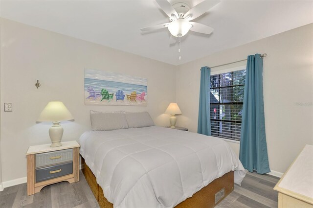 bedroom featuring ceiling fan and wood-type flooring