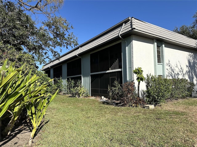 view of home's exterior featuring a lawn