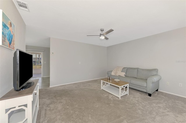 carpeted living room featuring ceiling fan