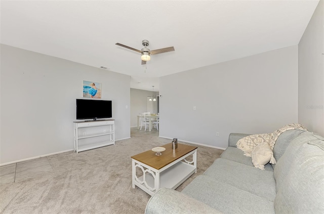 carpeted living room featuring ceiling fan