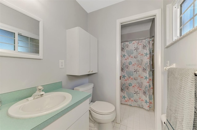 bathroom with a shower with curtain, vanity, toilet, and a healthy amount of sunlight