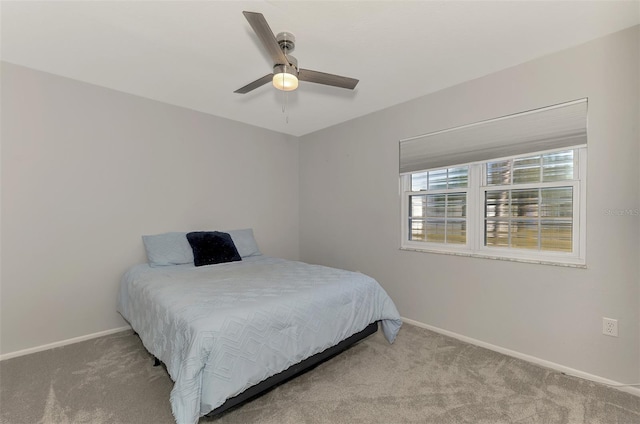 bedroom with light colored carpet and ceiling fan