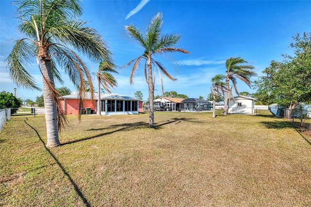 view of yard featuring a sunroom