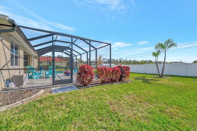 view of yard featuring a fenced in pool and a lanai