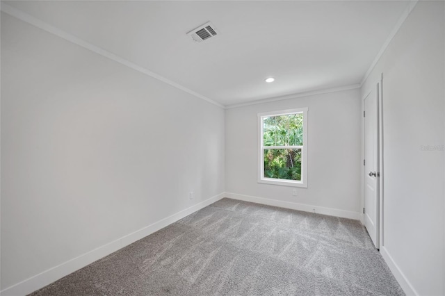 carpeted empty room featuring ornamental molding