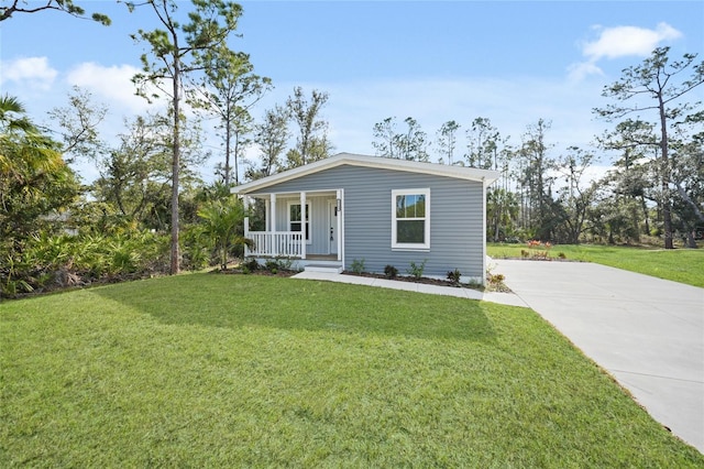 view of front of house with covered porch and a front lawn