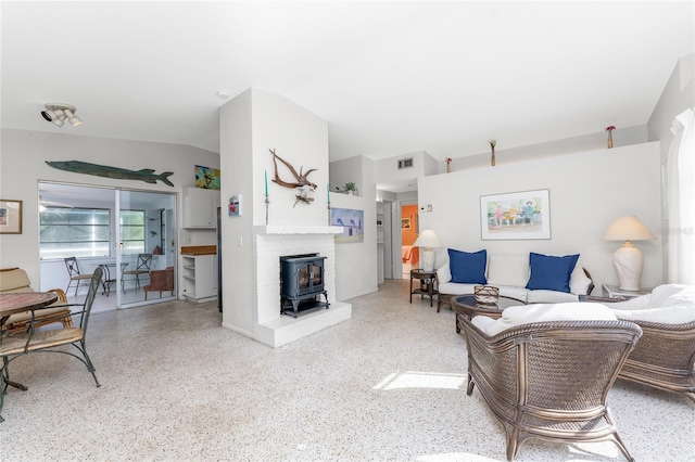 living room featuring a wood stove