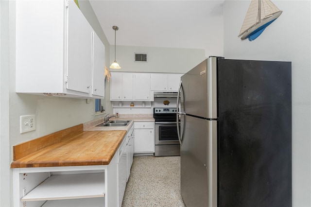 1770 Hudson St, Englewood, FL 34223 - kitchen with white cabinets, sink, butcher block countertops, decorative light fixtures, and stainless steel appliances