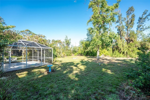 1770 Hudson St, Englewood, FL 34223 - view of yard with glass enclosure and a patio