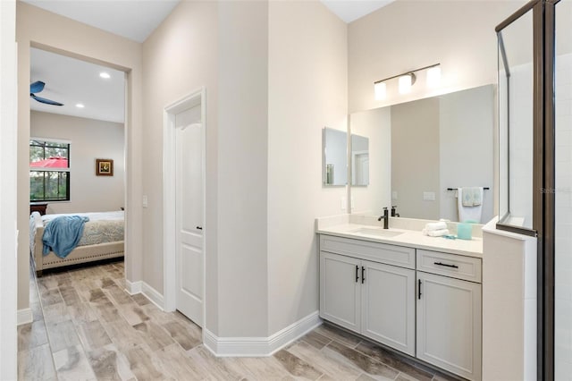 bathroom with vanity and a shower with shower door