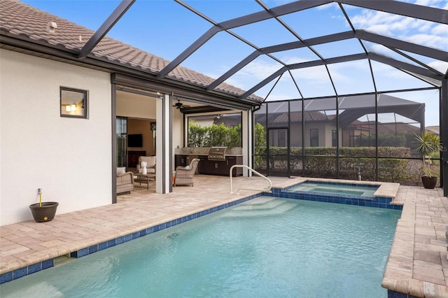 view of pool with glass enclosure, an outdoor hangout area, an in ground hot tub, exterior kitchen, and a patio