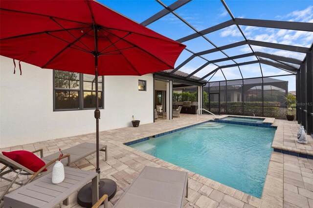 view of swimming pool featuring a lanai, an in ground hot tub, and a patio