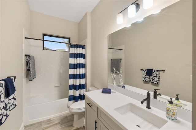 full bathroom featuring vanity, shower / bath combination with curtain, and toilet