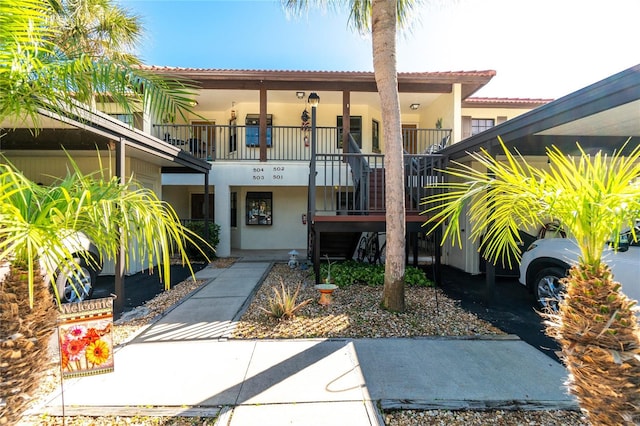 view of front of home with a balcony