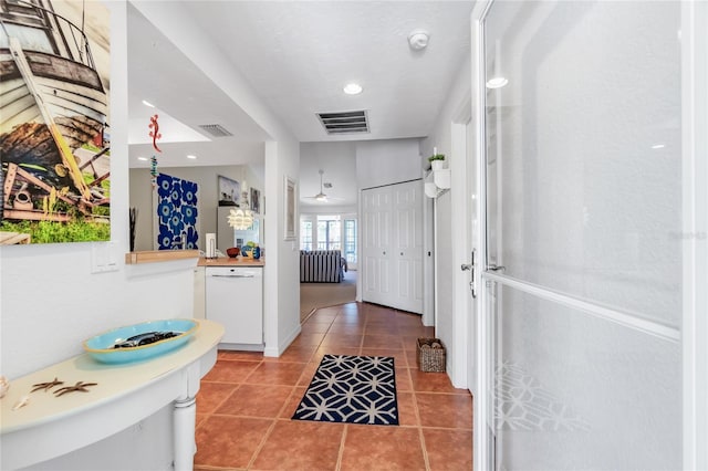 hall featuring tile patterned flooring