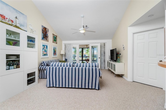 living room with ceiling fan, carpet, and lofted ceiling