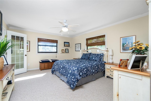 carpeted bedroom featuring ceiling fan, crown molding, and multiple windows