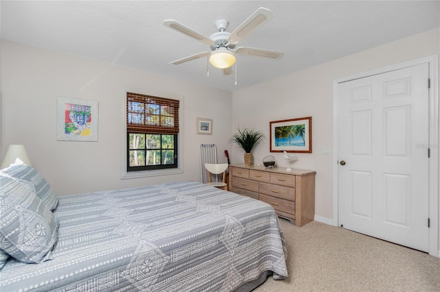 carpeted bedroom featuring ceiling fan