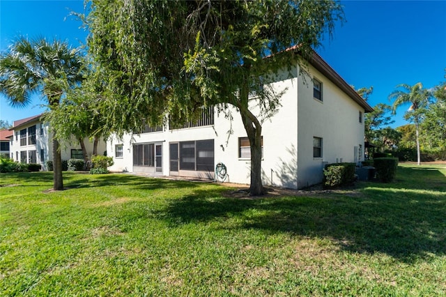 back of house featuring a yard