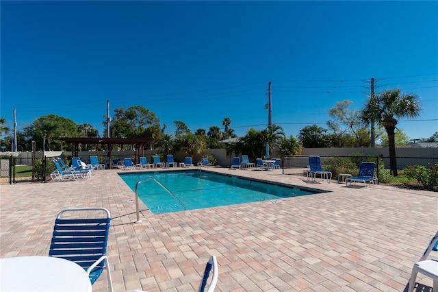 view of swimming pool with a patio