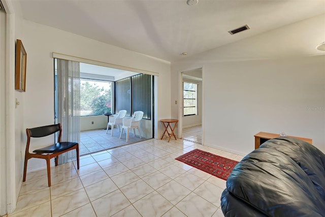 tiled living room with a wealth of natural light