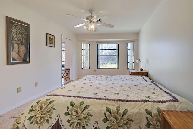 tiled bedroom with ceiling fan