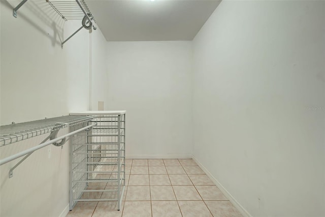 spacious closet featuring light tile patterned floors