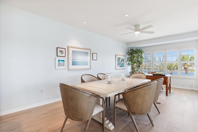 dining room featuring recessed lighting, light wood-style flooring, a ceiling fan, and baseboards