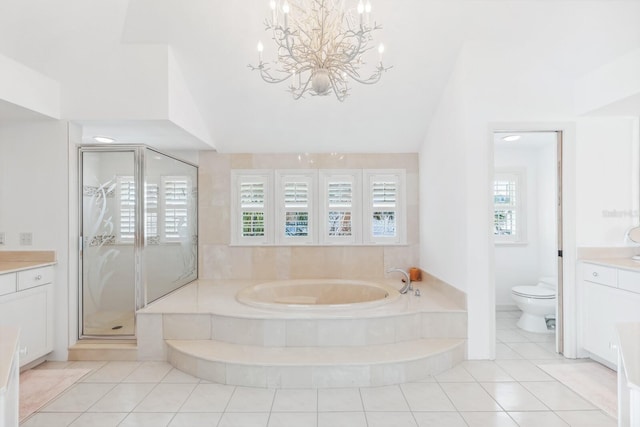 full bath with a shower stall, toilet, a garden tub, lofted ceiling, and vanity