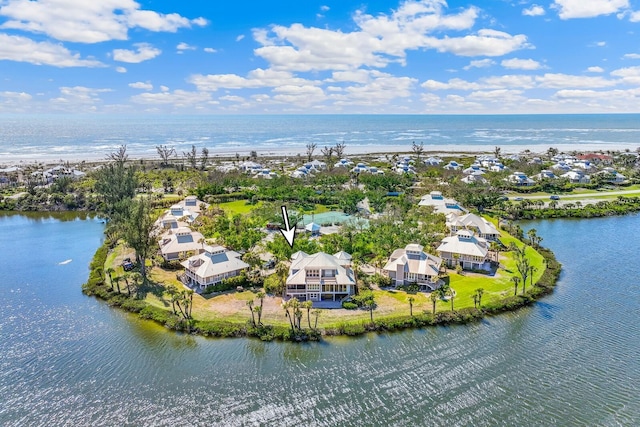 birds eye view of property with a residential view and a water view