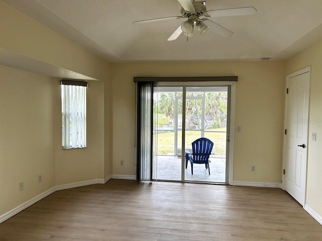 328 Baytree Dr, Rotonda West, FL 33947 - spare room with light wood finished floors, baseboards, and ceiling fan