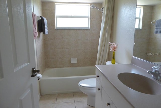 328 Baytree Dr, Rotonda West, FL 33947 - bathroom with toilet, tile patterned floors, plenty of natural light, and vanity