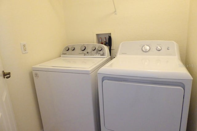 328 Baytree Dr, Rotonda West, FL 33947 - laundry room with washing machine and dryer