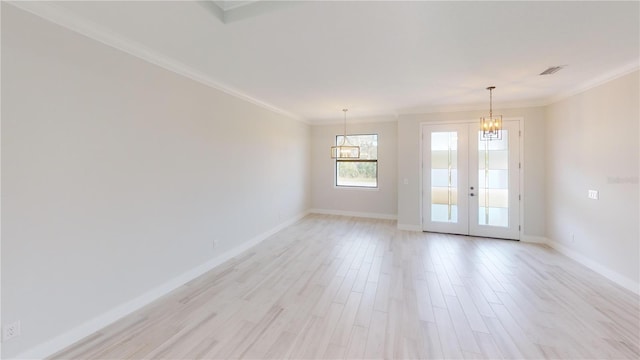 7330 Printer St, Port Charlotte, FL 33981 - spare room featuring a chandelier, ornamental molding, baseboards, light wood-style flooring, and french doors