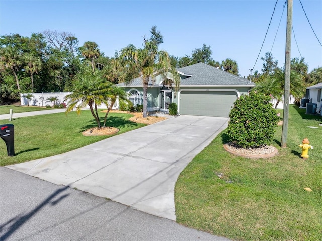 single story home featuring a front yard and a garage