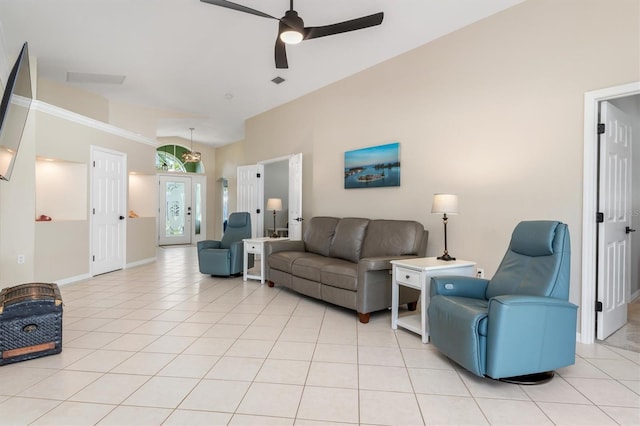 tiled living room with ceiling fan