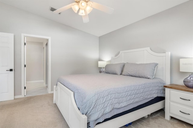 bedroom featuring light carpet and ceiling fan