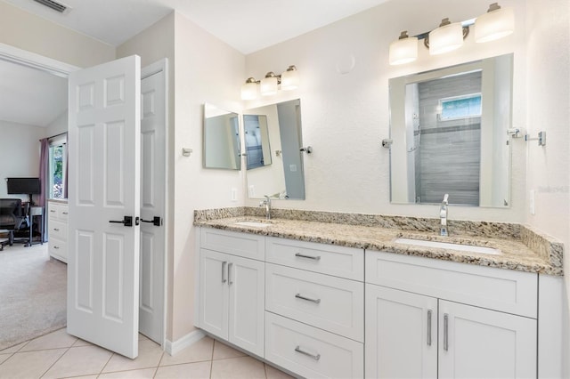 bathroom with tile patterned floors and vanity